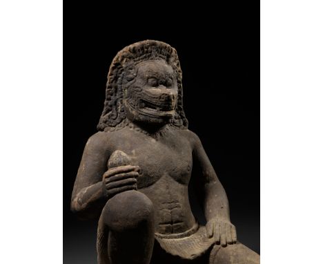 A MONUMENTAL SANDSTONE FIGURE OF NARASIMHA, KHMER EMPIRE, 10TH-12TH CENTURYFinely carved to depict an imposing anthropomorphi