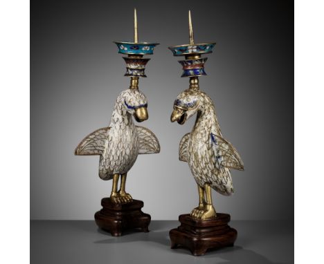 A PAIR OF CLOISONNE ENAMEL 'BIRD' CANDLESTICKS, QIANLONG PERIODChina, 1736-1795. Each bird modeled standing with outstretched