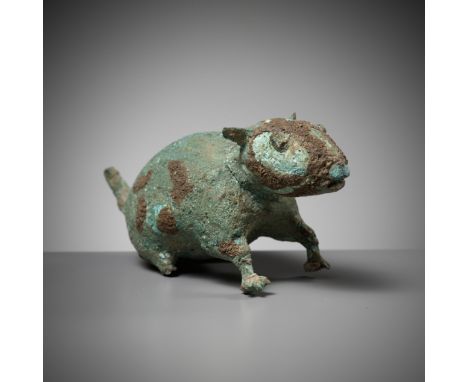 A RARE BRONZE FIGURE OF A RAT, DONG SON CULTUREVietnam, 500 BC to 300 AD. Well cast standing foursquare with the head slightl