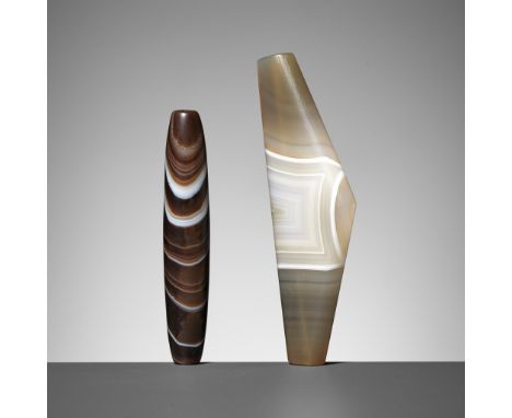 TWO LARGE WESTERN ASIATIC BANDED AGATE BEADS, 1ST MILLENNIUM BC OR EARLIERComprising a bead of slightly convex cylindrical fo