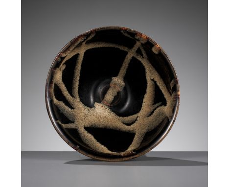 A JIZHOU PHOSPHATIC-SPLASHED BLACK-GLAZED BOWL, SOUTHERN SONG DYNASTYChina, 1127-1279. The bowl is potted with conical sides 