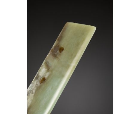 A GREEN JADE CEREMONIAL BLADE, NEOLITHIC PERIODChina, 3rd millennium BC. Of trapezoidal form with a straight upper edge and b