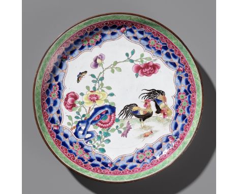 A RARE CANTON ENAMEL 'COCKERELS' DISH, YONGZHENG TO EARLY QIANLONG PERIODChina, circa 1730-1740. Painted in vibrant colors wi