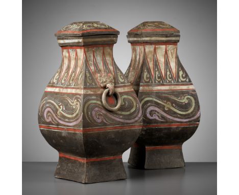 A PAIR OF LARGE PAINTED POTTERY SQUARE VASES AND COVERS, FANGHU, HAN DYNASTYChina, 202 BC to 220 AD. Each with a facetted pea