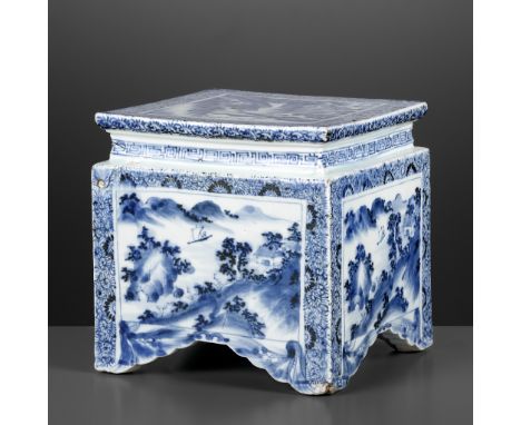 A MASSIVE BLUE AND WHITE 'LANDSCAPE' STAND, LATE MING TO EARLY QING DYNASTYChina, 17th-18th century. Supported on four short 