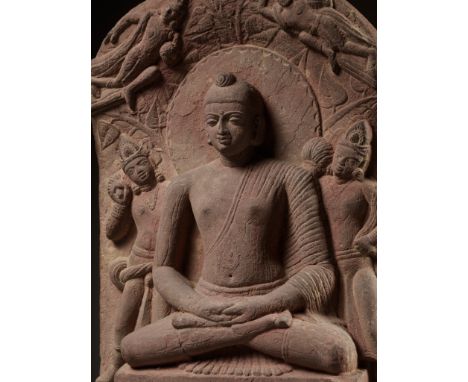 A PINK SANDSTONE STELE OF BUDDHA SHAKYAMUNI, KUSHAN PERIOD, MATHURA, LATE 1ST TO EARLY 2ND CENTURYOf rectangular form with an