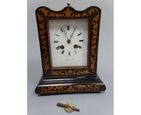 A FRENCH MANTEL CLOCK, c.1870, having shaped top to ebonised case with floral and foliate inlay, lifting glass to white ename