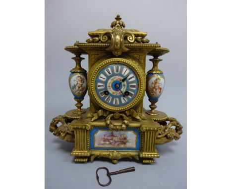 A FRENCH ORMOLU MANTEL CLOCK, c.1880, the central blue ceramic barrel face with Roman numeral dial flanked by urn supports, d