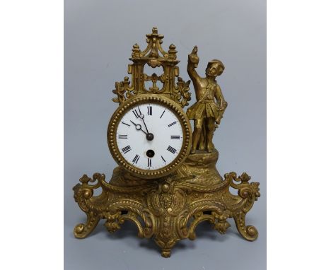 A GILT METAL FIGURAL BARREL MANTEL CLOCK, having circular white enamelled dial with Arabic chapter ring supported on scrollin