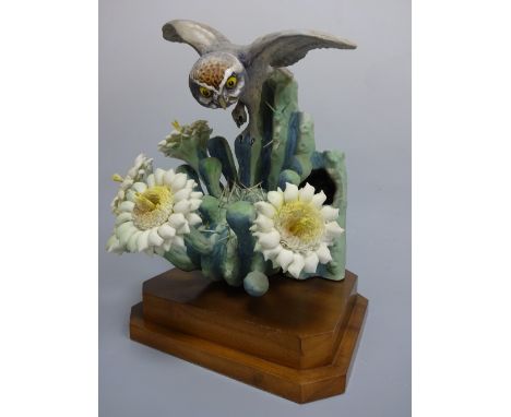 A ROYAL WORCESTER MOONLIGHT ELF OWL, Micropallas Whittneyi Whittneyi & Giant Saguaro by D. Doughty, on stepped wooden plinth,