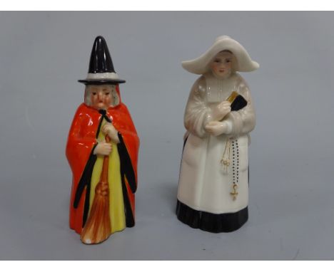 TWO ROYAL WORCESTER CANDLE SNUFFERS, witch with red cape, black painted hat and broom, puce mark Rd.No.610726 and 2543 c.1914