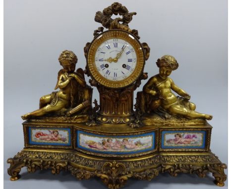 A FRENCH MANTEL CLOCK, having circular enamelled dial with Roman numeral chapter ring with Arabic ring, inscribed Grignon Meu