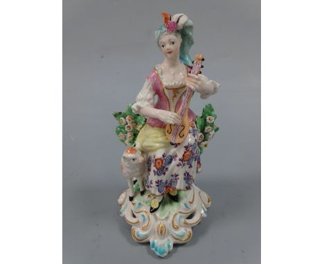 AN 18TH CENTURY DERBY FIGURINE, c.1765-70, musical shepherdess, modelled as shepherdess sat on tree stump playing flute with 
