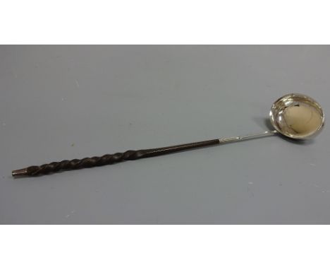 A WHITE METAL TODDY LADLE, with twisted handle, approximately 34cm
