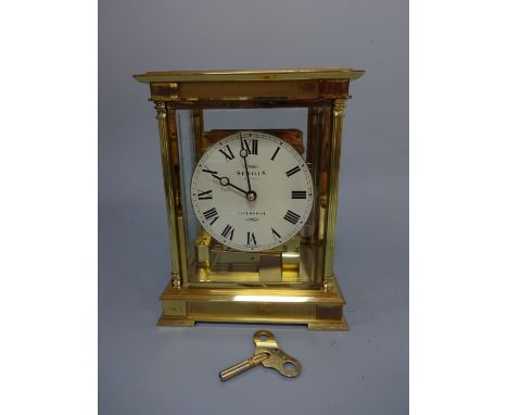 A SEWILLS LIVERPOOL FOUR GLASS ST GEORGE MANTEL CLOCK, circular white enamelled dial inscribed Sewills Estd 1800ad Liverpool,