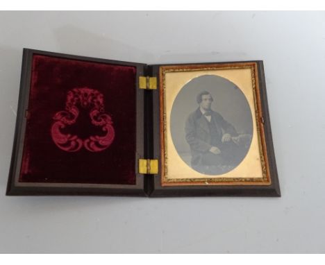A PORTRAIT DAGUERREOTYPE, seated gent, set within hinged, velvet lined case, approximately 13cm x 10.5cm max