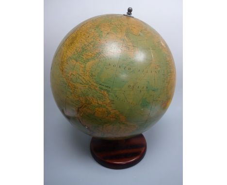 A PHILIPS 19 INCH TERRESTRIAL GLOBE, printed in Great Britain by George Philip & Son Ltd London 1970, on wooden stand