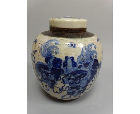 A BLUE AND WHITE ORIENTAL GINGER JAR AND COVER, decorated with dragon chasing flaming pearl to body, banding to top, approxim