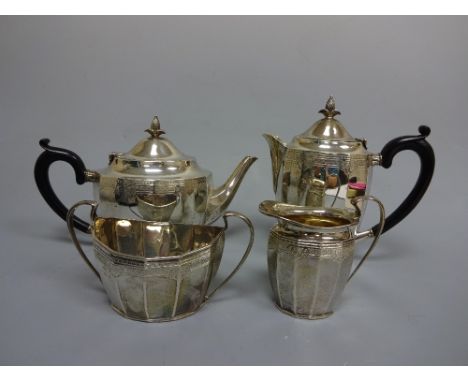 A SILVER FOUR PIECE TEA SERVICE, of dodecagon form with engraved scroll and floral strapwork to tops, teapot and hot water wi