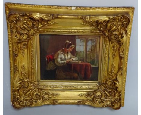 A GILT FRAMED OIL, portrait study, female seated at table reading before window, label verso inscribed No.41 'A Study J.W. Ha