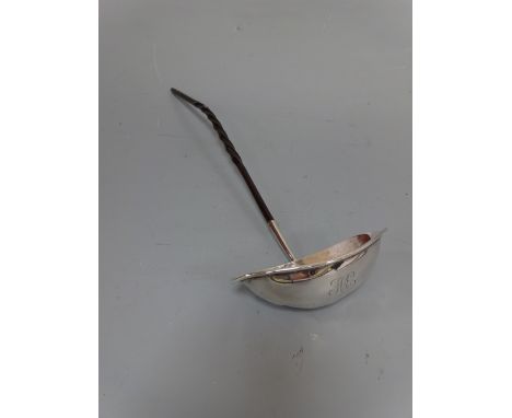 A SILVER TODDY LADLE, having turned handle to lipped bowl monogrammed HE, Sheffield 1909, approximately 36cm