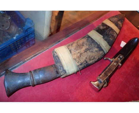 German scout knife with metal scabbard and a Kukuri knife  CONDITION REPORT: Scout knife blade has sharping wear marked. L: 1
