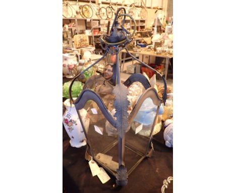 Metal and glass light pendant in the form of a street lamp head with open top 