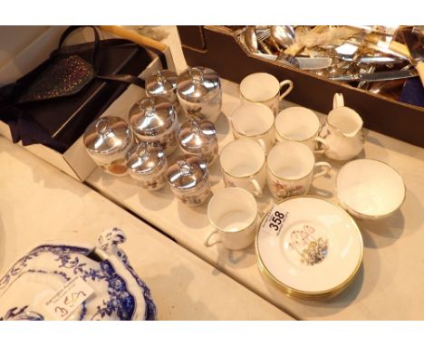 Six coffee cans and seven egg coddlers by Royal Worcester 