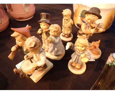 Four Goebel figurines including Boy and Girl 