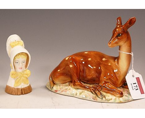 A Royal Worcester young girl candle-snuffer, h.8cm; together with a Beswick model of a recumbent deer, impressed mark verso a