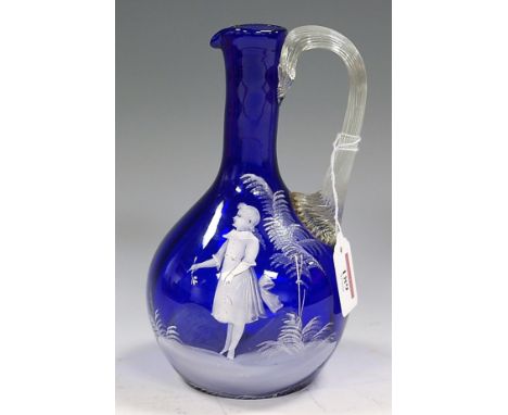 A Victorian Mary Gregory blue glass decanter, typically decorated with a female figure amongst foliage, h.21cm