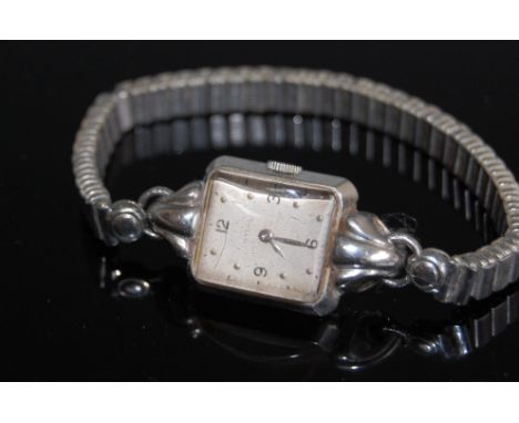 An Art Deco ladies Omega steel cased wristwatch, having manual wind movement, signed silvered tank dial with oversize lugs, o