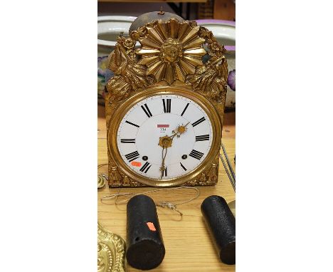 A 19th century French comtoise clock, having convex enamelled dial with Roman numerals, the eight day movement striking on a 