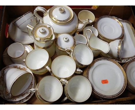 A George Jones & Sons part tea and coffee service, on a cream ground within gilt borders, pattern No.20501, printed mark vers
