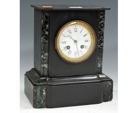 An Edwardian black slate and faux marble cased mantel clock, having enamelled dial with Roman numerals, and eight day movemen