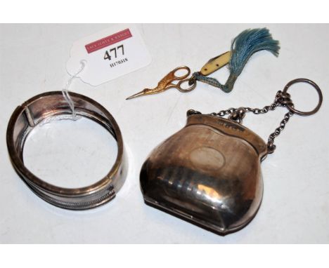 A silver hinged bangle together with a silver ladies purse, a miniature sewing scissors and pocket knife (4)
