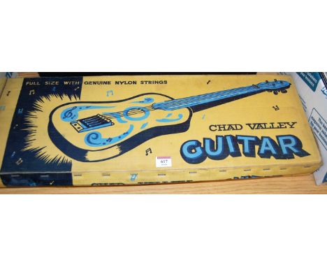 A boxed Chad Valley tinplate guitar