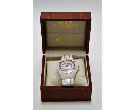 An Oniss white ceramic gents quartz bracelet watch with box and papers, apparently unworn