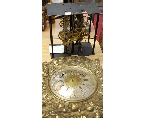 A 19th century French brass comtoise clock movement, with separate brass dial and surround with repousee floral decoration (2