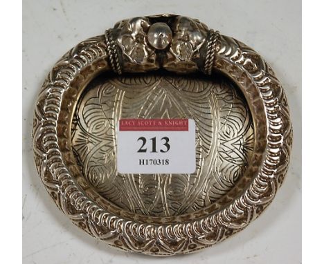 A 20th century Egyptian silver trinket dish, having incised interior within bracelet-like surround