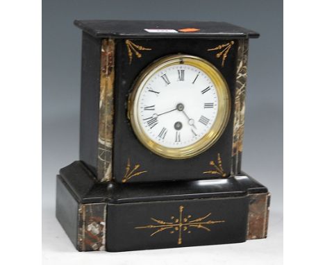 An Edwardian black slate and faux marble cased mantel clock, having enamelled dial with Roman numerals, and cylinder movement