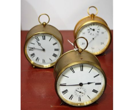 An early 20th century lacquered brass cased drum shaped mantel clock, having enamelled dial with Roman numerals, and subsidia