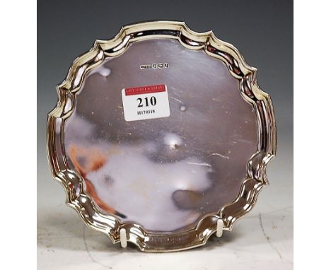 A George V silver card waiter of plain undecorated form within a piecrust border, Harrison Fisher & Co, Sheffield, 1935