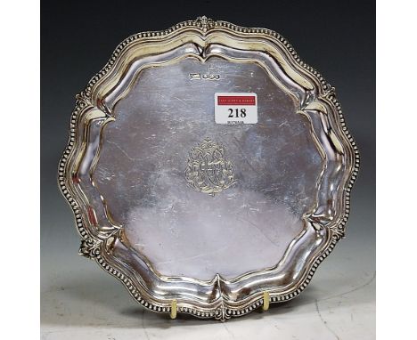 A George V silver waiter, having engraved centre within piecrust and beaded rim, maker Walker & Hall, Sheffield 1935