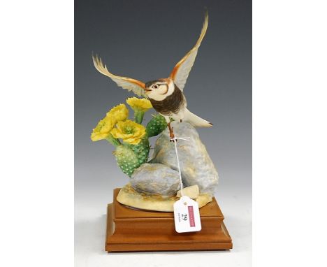 A large Royal Worcester figure of a Chestnut collared longspur (Calcarius Ornatus) and plains prickly pear, modelled by James