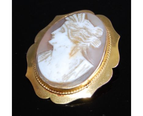 A carved shell cameo brooch, depicting profile portrait of a maiden, in 9ct gold mount with safety chain, 5.9g, cameo measure
