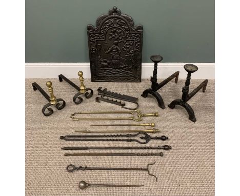 VINTAGE CAST IRON FIREBACK, two sets of Grate dogs and a mixed quantity of iron and brass fireirons, 69 (H) x 46cm across the