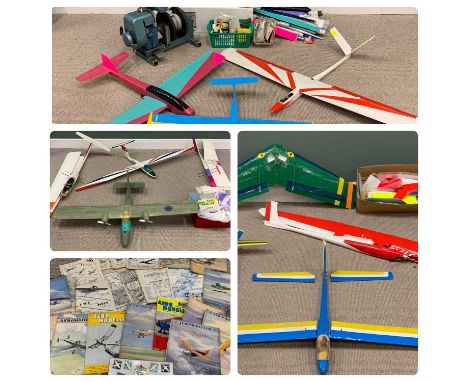 ELEVEN REMOTE CONTROL MODEL GLIDERS/PLANES & ASSOCIATED GOODS, to include a petrol motor glider winch launch, 46 (H) x 56 (W)