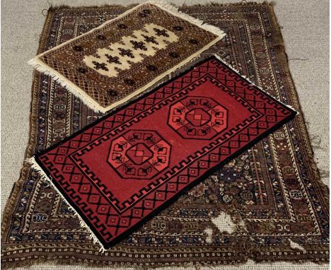 THREE VINTAGE AND LATER EASTERN STYLE WOOLEN RUGS, the largest example has an all-over colourful traditional pattern, multi-b