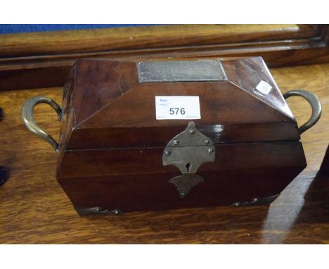 A Victorian mahogany sarcophagus formed tea caddy with silver plated mounts and a presentation plaque marked In Affectionate 